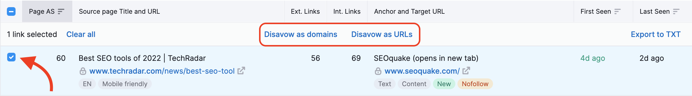 A red arrow is pointing to the select box and the Disavow as domains and Disavow as URLs buttons are highlighted above the selected backlink. 